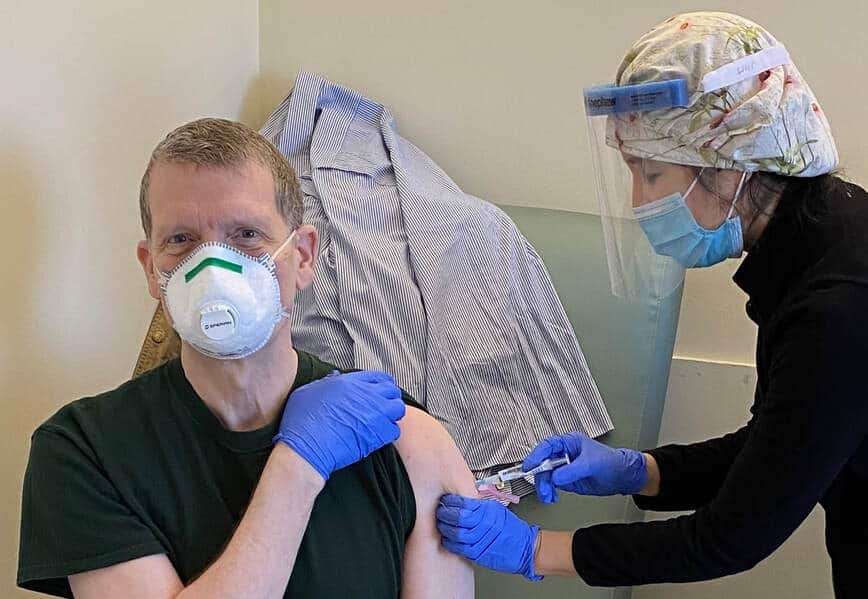 Dr. Donald Thomas gets the COVID-19 vaccine